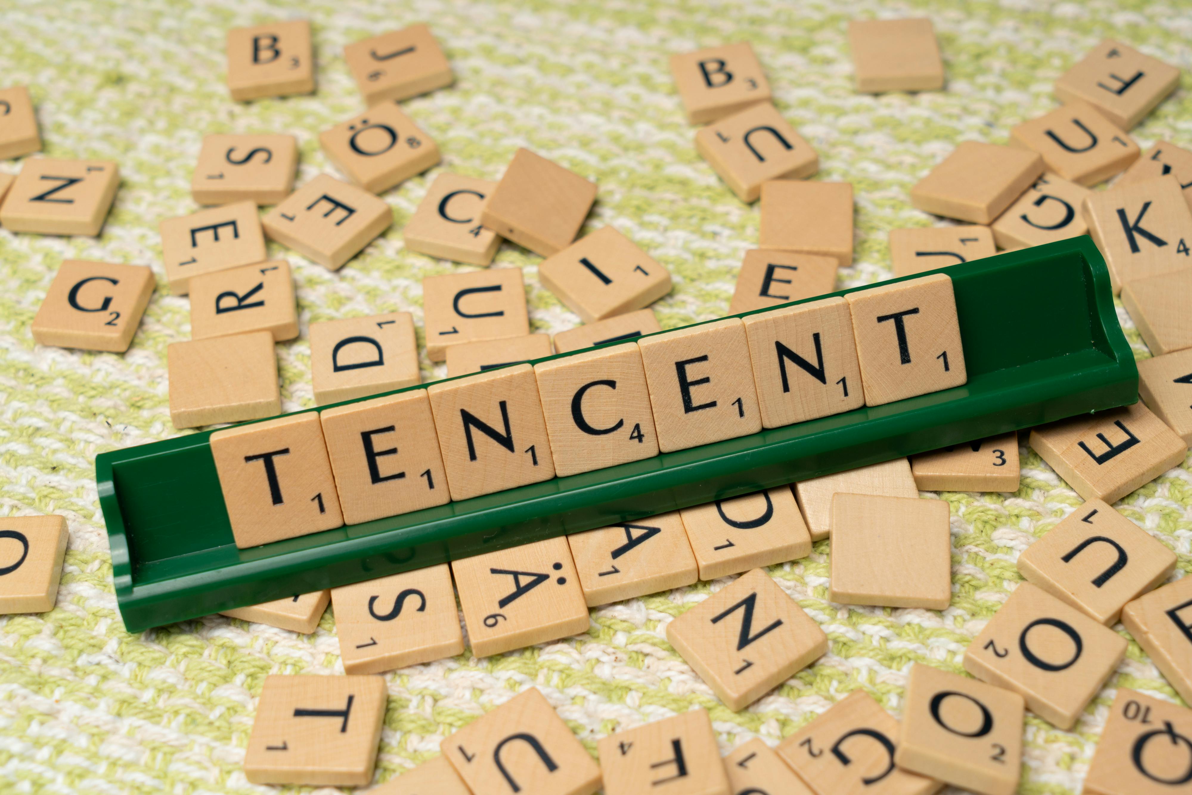 Tenent - a word that is spelled with scrabble tiles