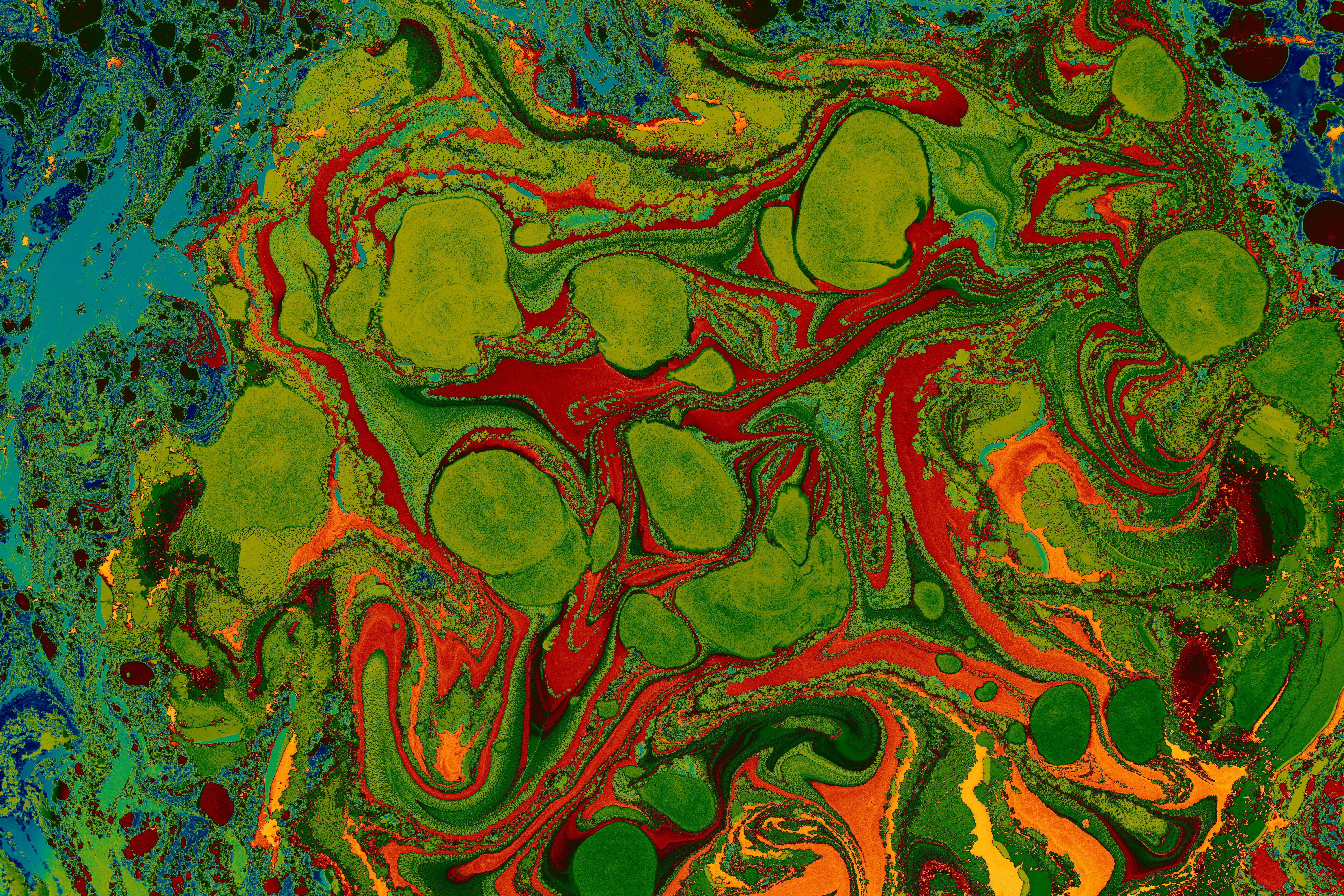 A colorful painting with green, orange and red swirls