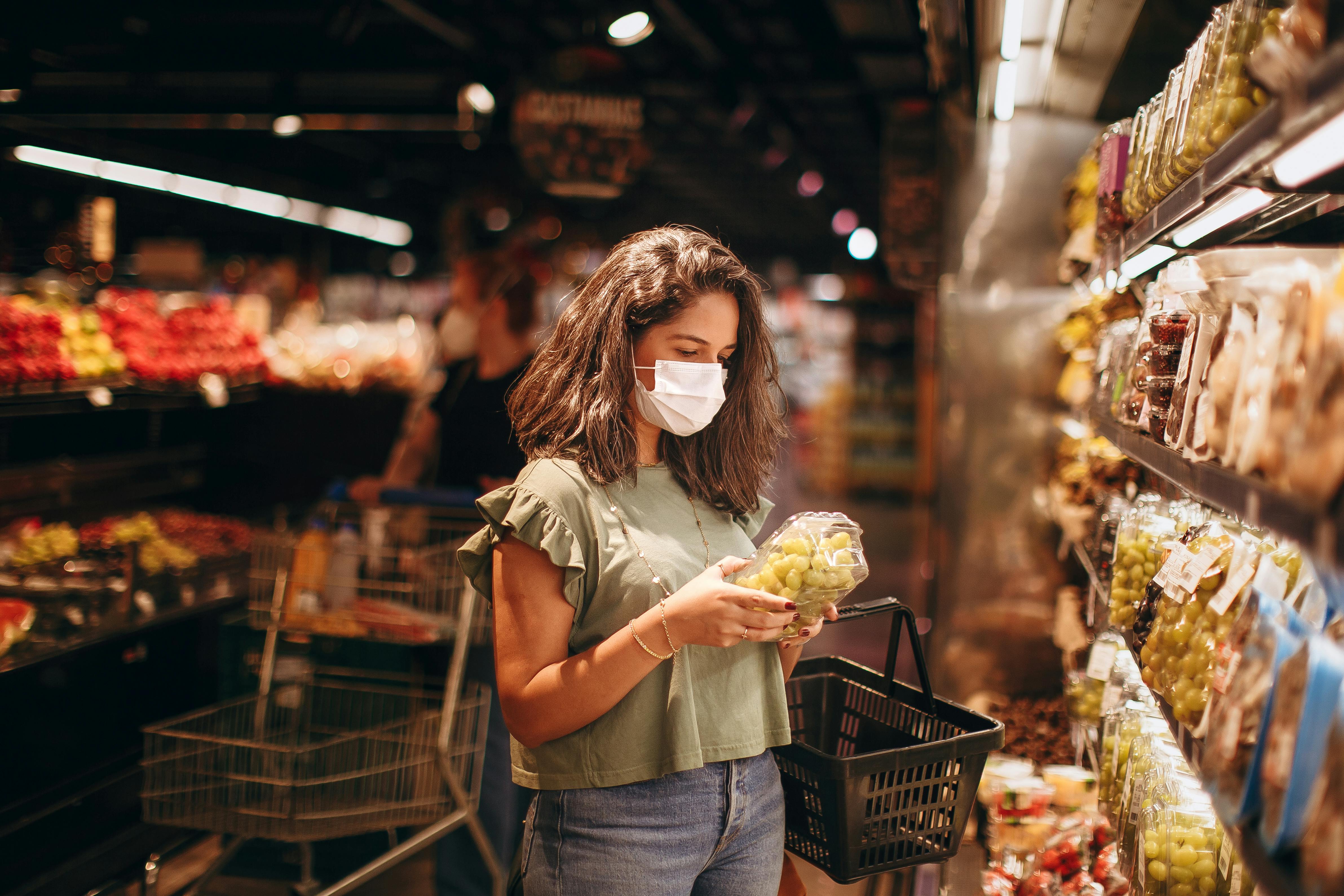 Woman wearing a face mask in a grocery store